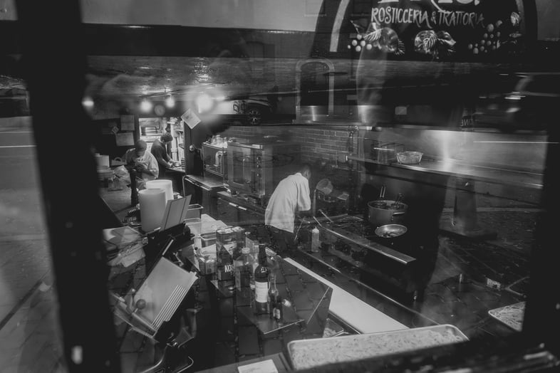 chefs cooking through window