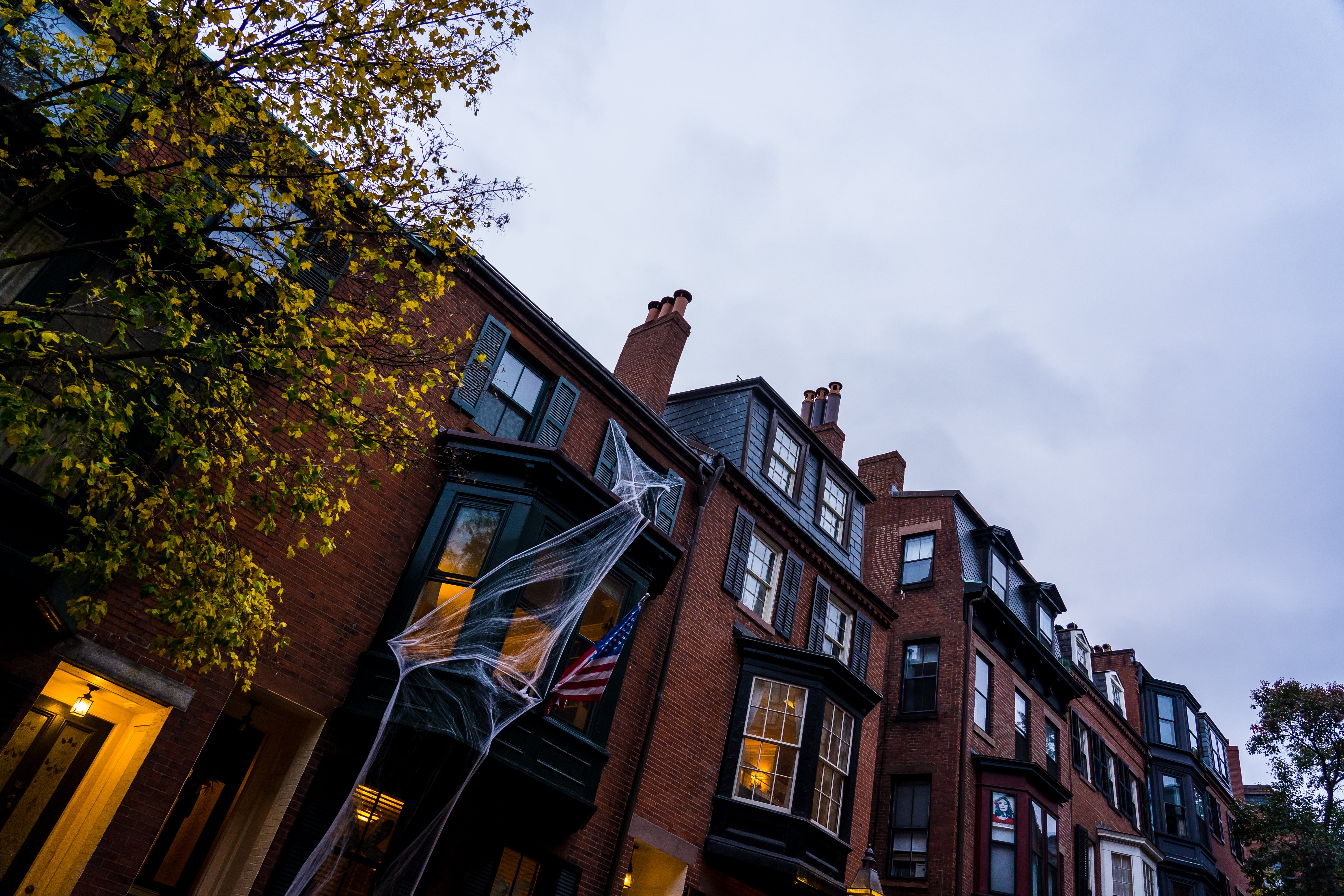 brick building with spider web decorations